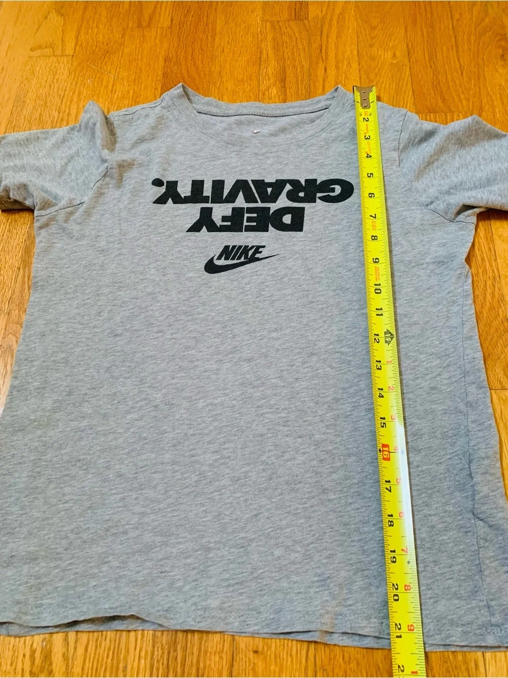 2 Nike Boys L Shirts : Defy Gravity' Nike tee and a green Milltown United jersey
